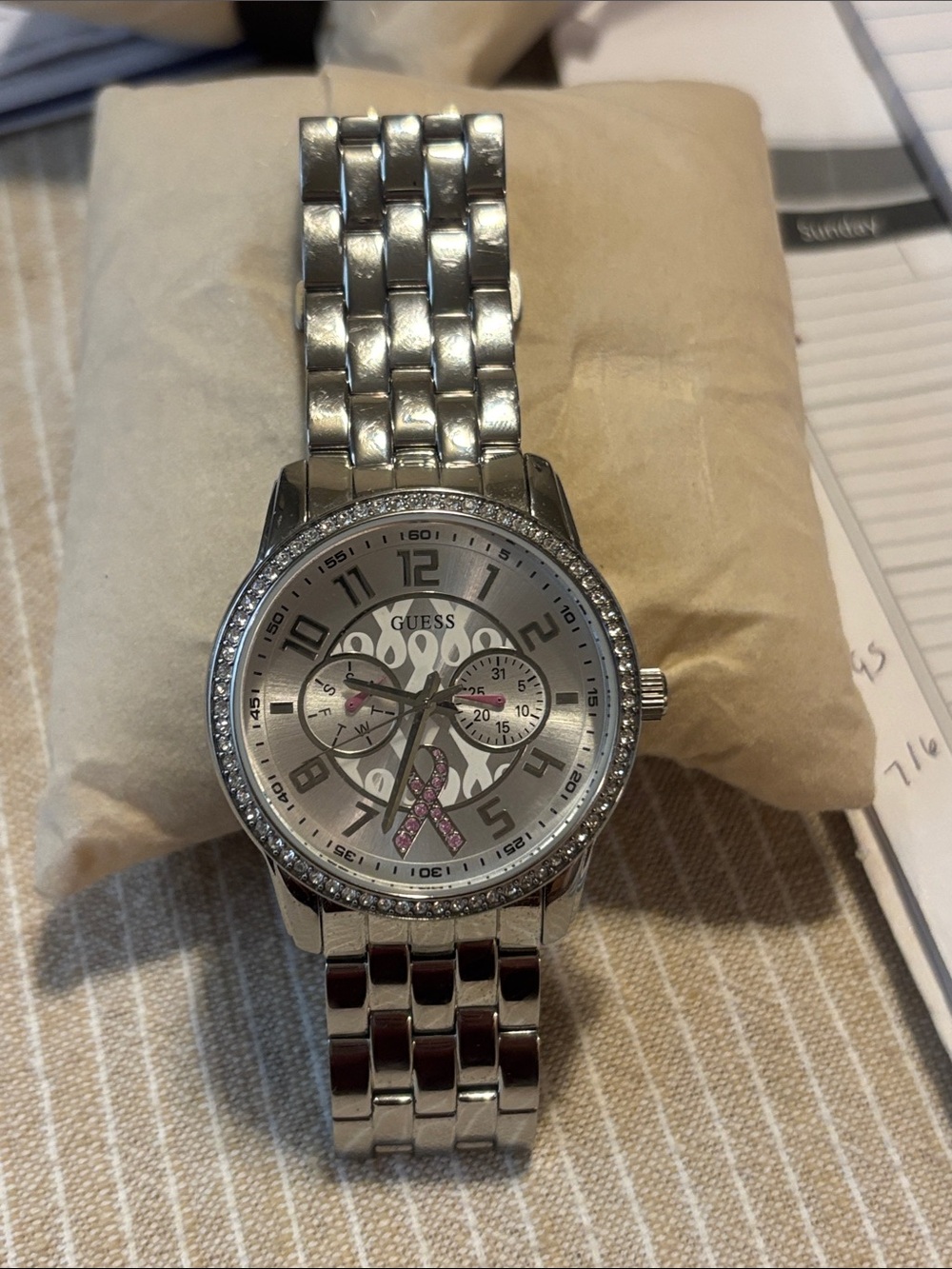 GUESS Silver-Tone Stainless Steel Watch with Pink Ribbon Accent